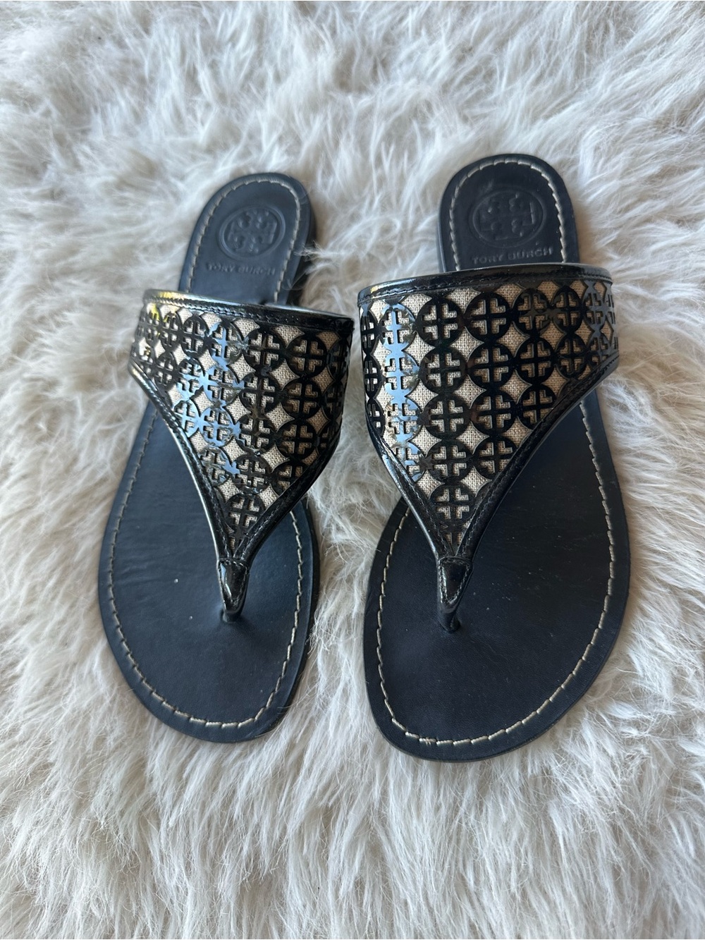 Tory Burch Black leather Sandals with Logo Cutouts beige background 8